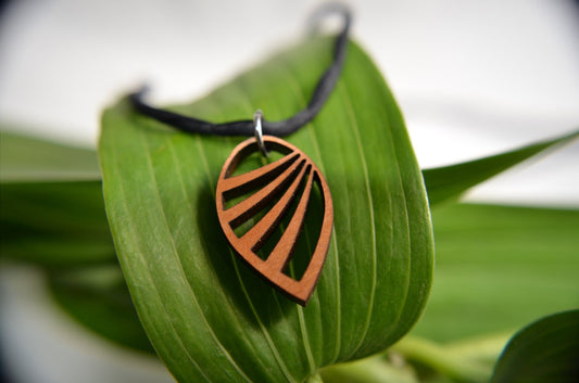 Wing Pendant in cherry on leather cord